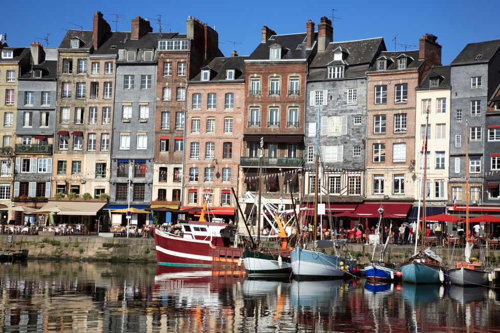 the very attractive port of honfleur in the calvados region of france normandy one of the most painted scenes in france monet, courbet, etc, it is known for its old, picturesque port, characterized by slate covered frontages and played a role on the impressionist movement