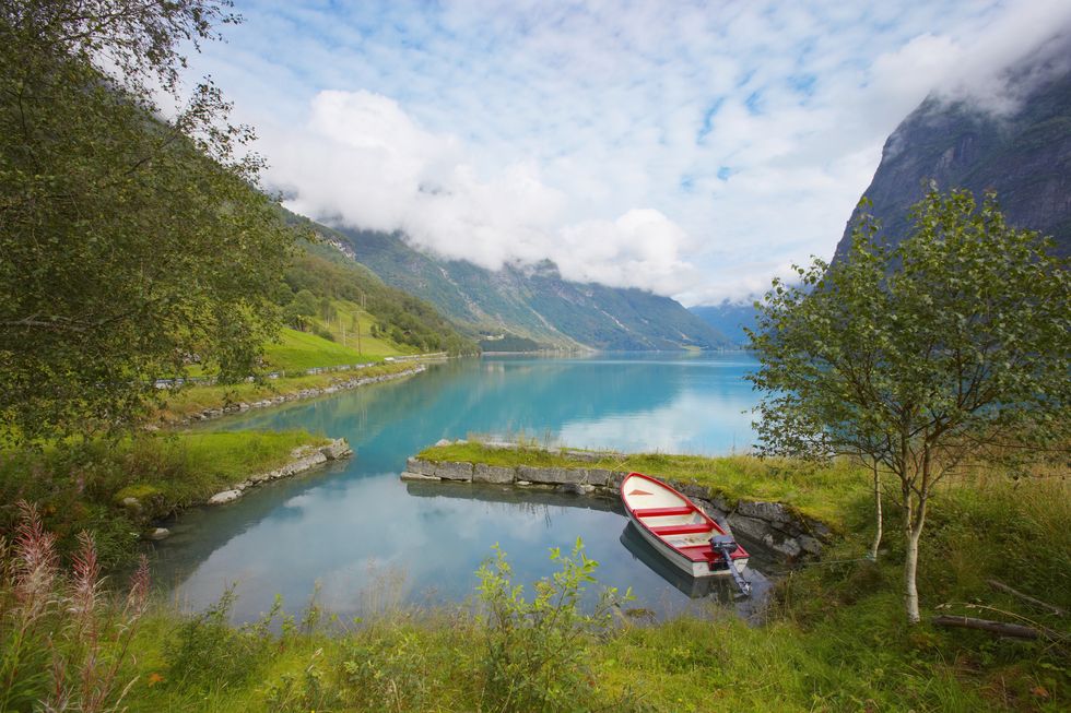 a boat on a river in norway