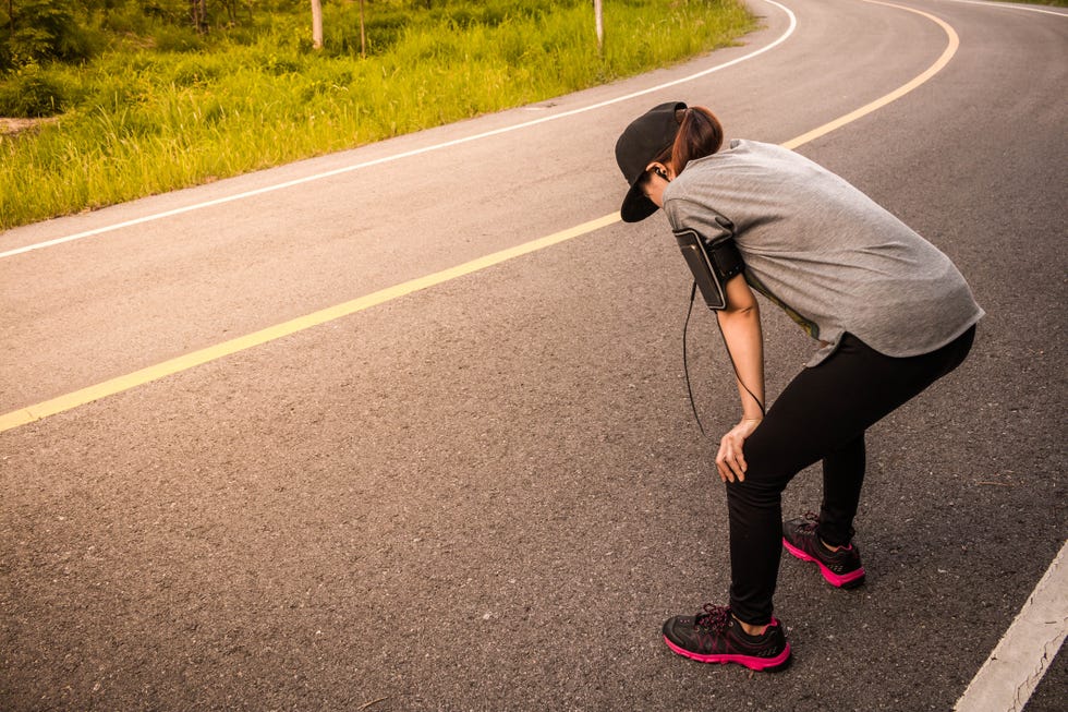 Side View Of Woman Standing On Road