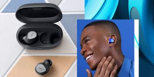 jabra earbuds in charging case and person wearing blue master and dynamic earbuds