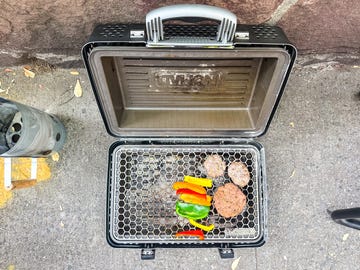 hamburgers and peppers on nomad grill and smoker