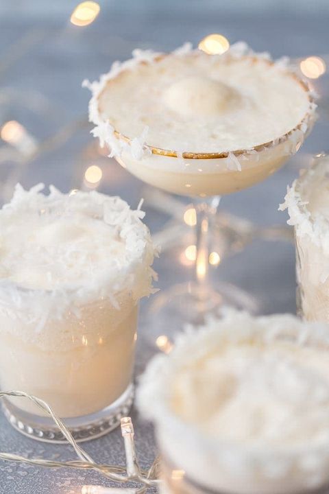 festive snow punch in different glasses with coconut
