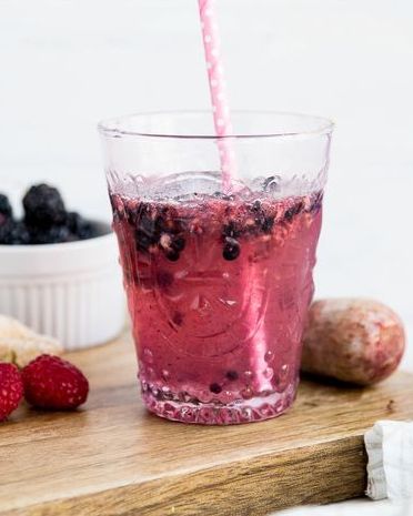 ginger berry mocktail on wood surface