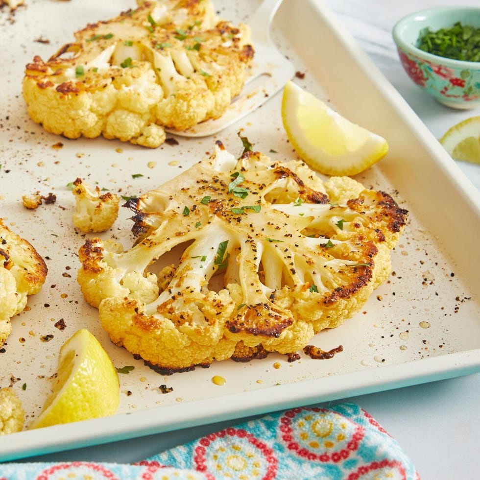 https://hips.hearstapps.com/hmg-prod/images/non-traditional-thanksgiving-dinner-ideas-cauliflower-steak-654aab203a293.jpeg?crop=1xw:1xh;center,top&resize=980:*