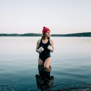 nordic woman stood on the baltic sea ready for cold water swimming