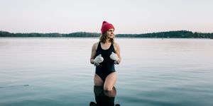 nordic woman stood on the baltic sea ready for cold water swimming
