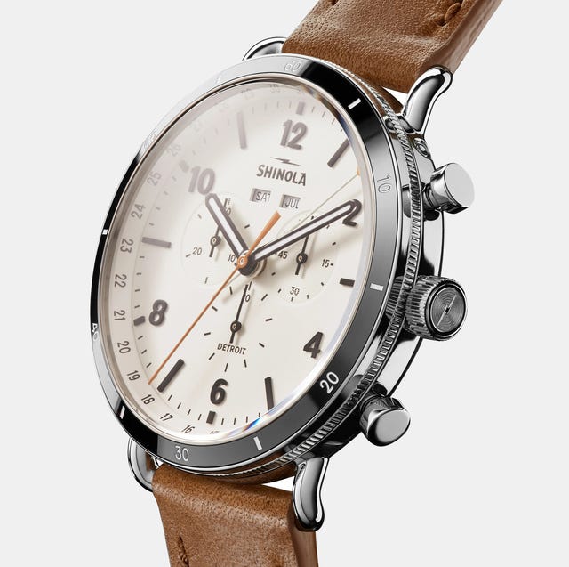 a silver watch with brown leather strap a silver watch with brown leather strap