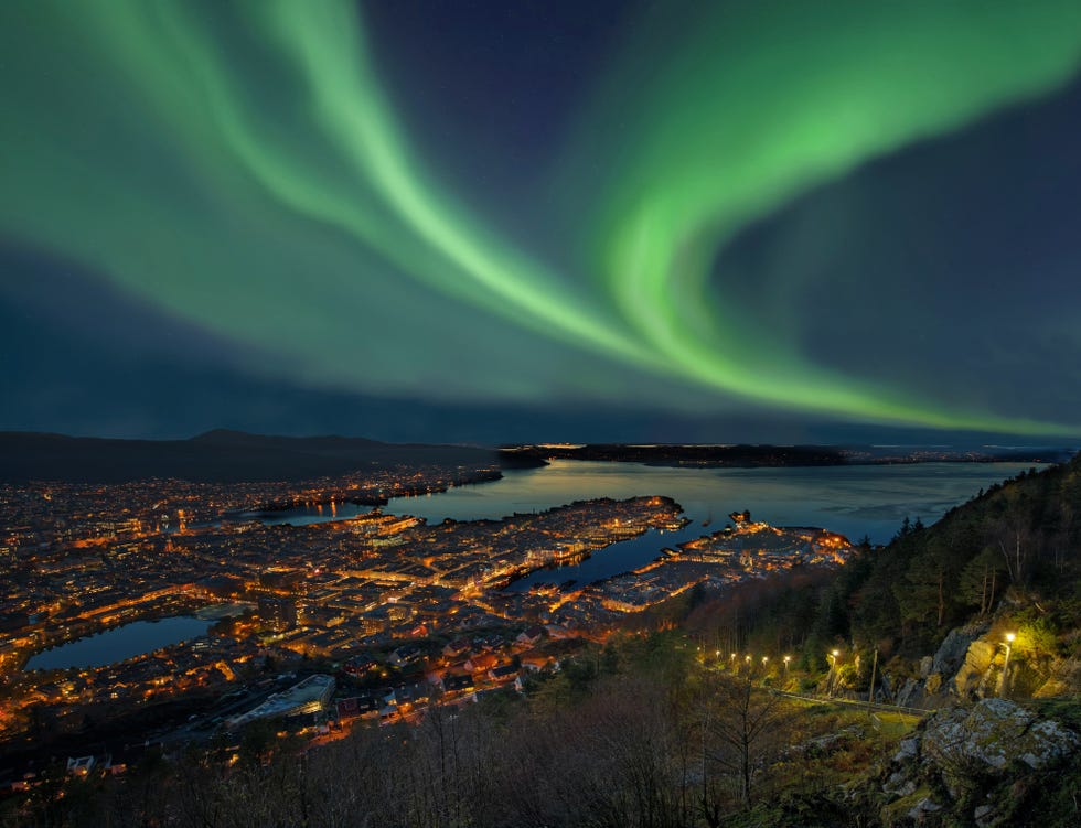 northern lights aurora borealis over harbor of bergen city, norway