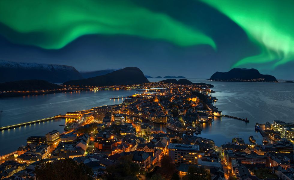 Northern lights - Green Aurora borealis over Alesund, Norway