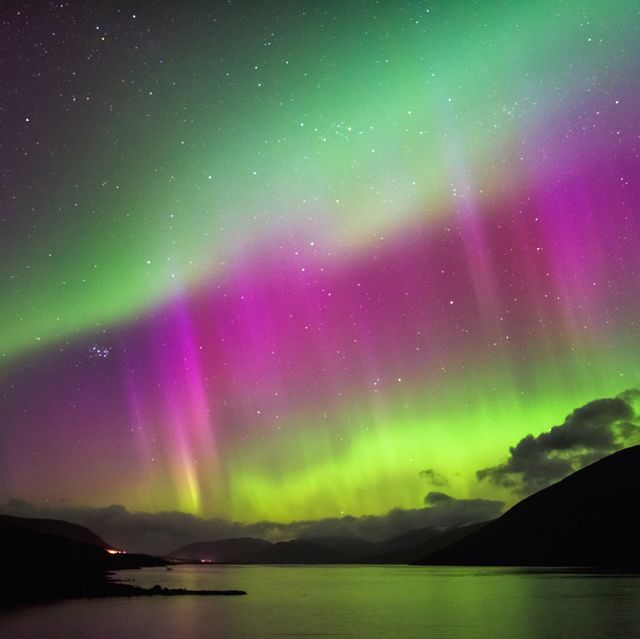 aurora borealis, also known as the northern loights, putting a show on dancing over loch glascarnoch, by garve, highlands of scotland, uk