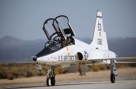 USAF Northrop T-38A talon taxiing with both canopies open and spoiler deployed