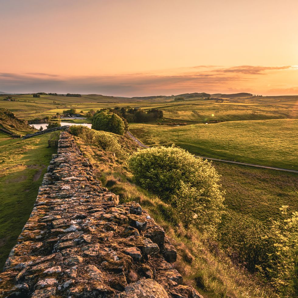 the view of the hadrians wall in the sunset near cawfield quarry