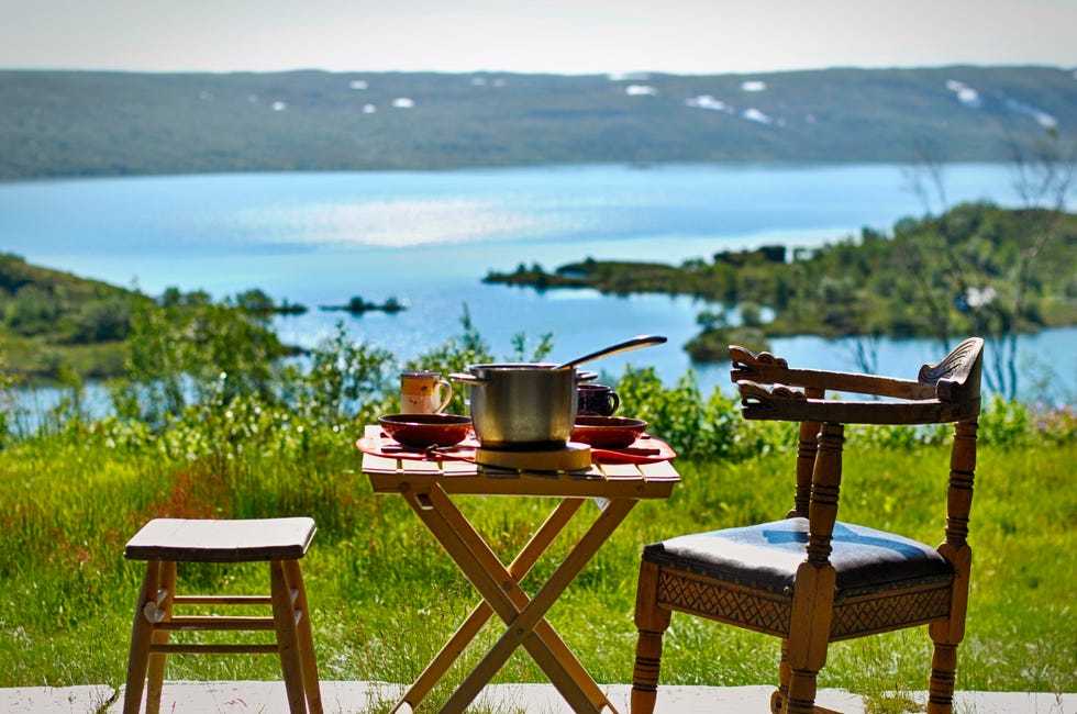 norwegian breakfast at ustaoset village in central norway with mountains in the back and the ustevatnet lake, scandinavia, europe hallingskarvet national nature park in norway perfect place for hiking and camping
