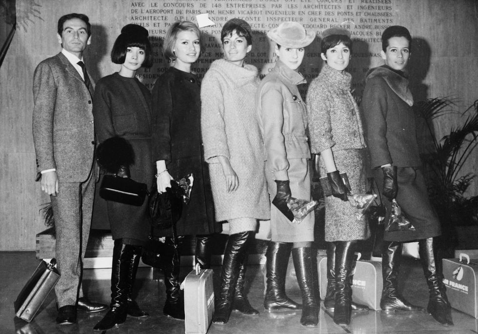 pierre cardin with models at airport