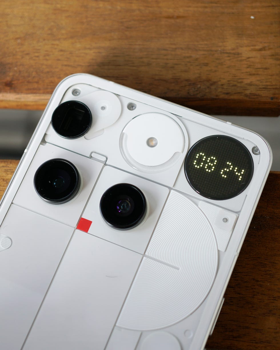 the back of the nothing phone 3 showing the camera layout and glyph matrix displaying the time