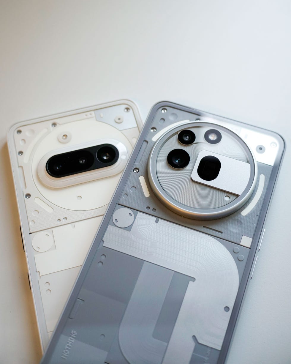 two smartphone bodies showcasing their internal components and camera arrangements