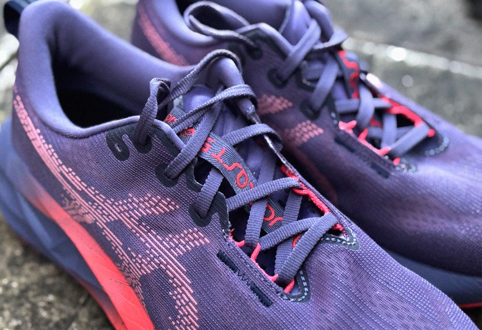 close up of a pair of purple running shoes