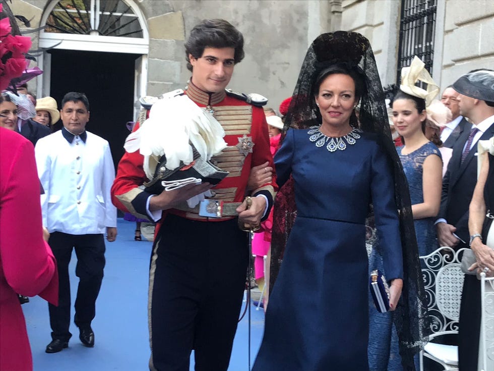 Fashion, Event, Dress, Carpet, Tradition, Smile, Costume, Fashion design, Fashion accessory, Haute couture, 