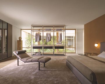an open wardrobe in a beige bedroom