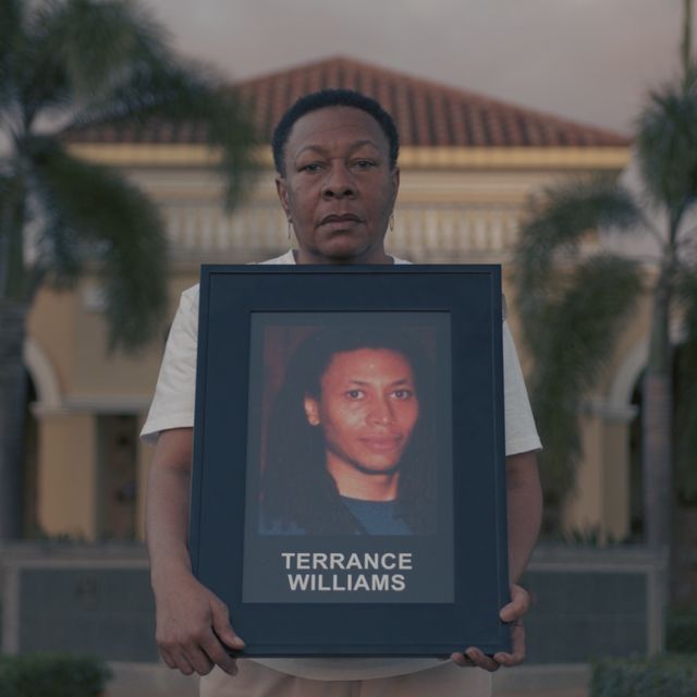 marcia williams holds portrait of missing son, terrance williams, in never seen again docuseries