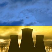 nuclear power plant on the background of flag of ukraine
