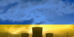 nuclear power plant on the background of flag of ukraine