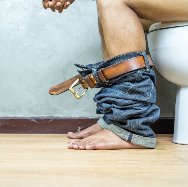 nude picture, man sitting on toilet bowl in the toilet, constipation concept