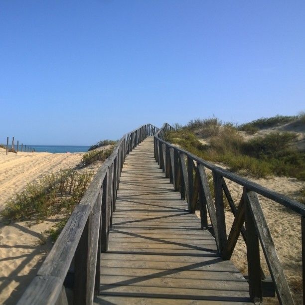 Boardwalk, Walkway, Sky, Beach, Sand, Sea, Nonbuilding structure, Coast, Dock, 