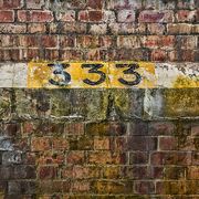 number 333 on brick wall