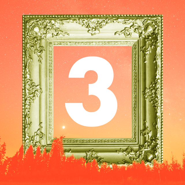 a giant number 3 is inside a golden picture frame over an orange lanscape