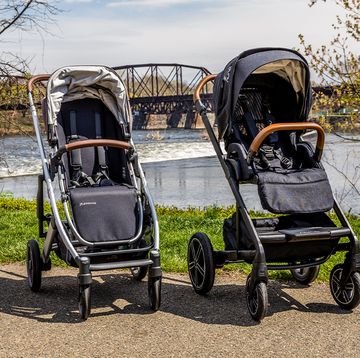 a nuna stroller and uppababy stroller placed next to each other outside