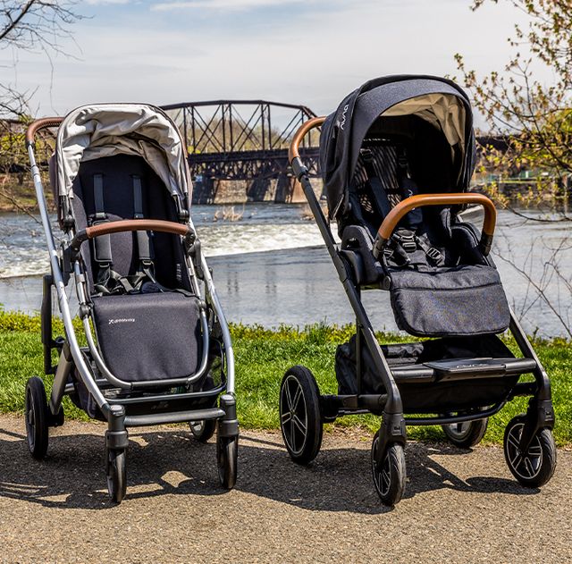 a nuna stroller and uppababy stroller placed next to each other outside