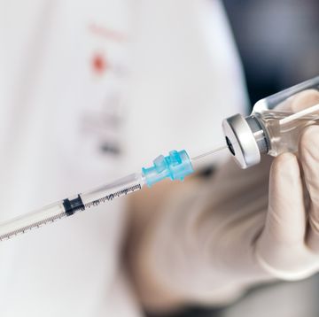 nurse injecting vaccine into a syringe vaccination concept coronavirus