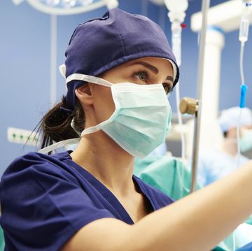 nurse working with technology in operating room