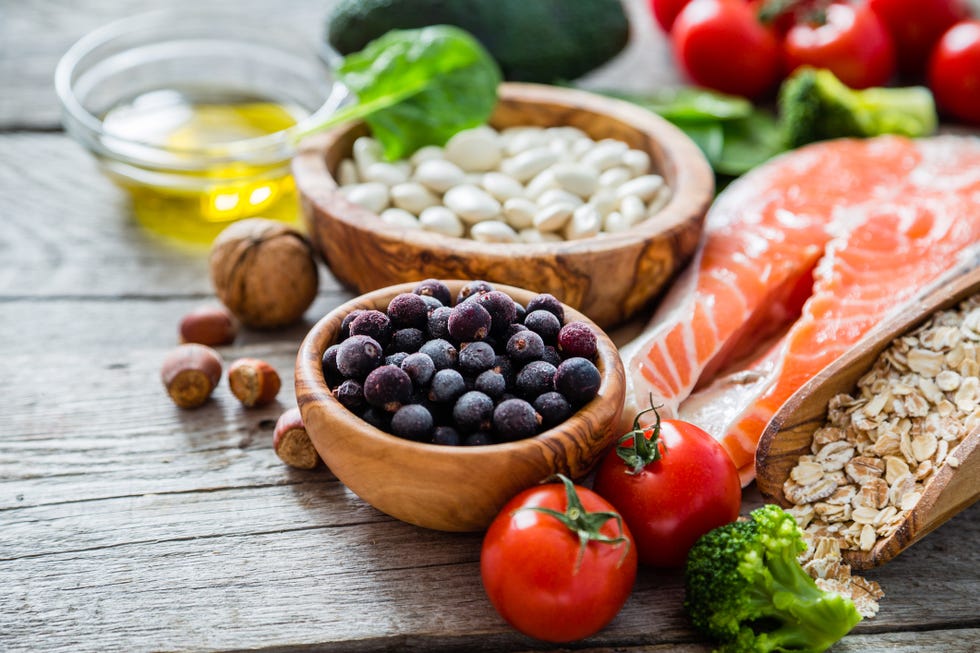 selection of food that is good for the heart, rustic wood background