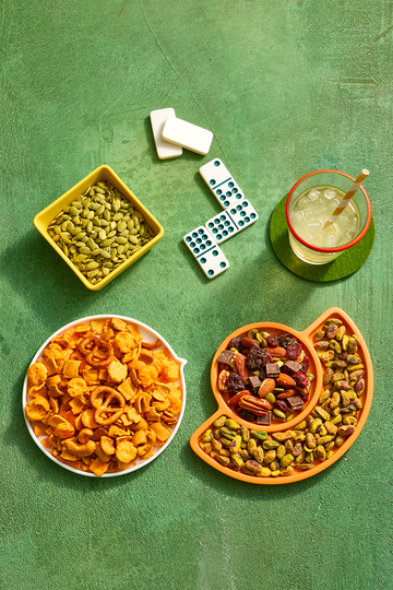 trail mixes in platters alongside board games