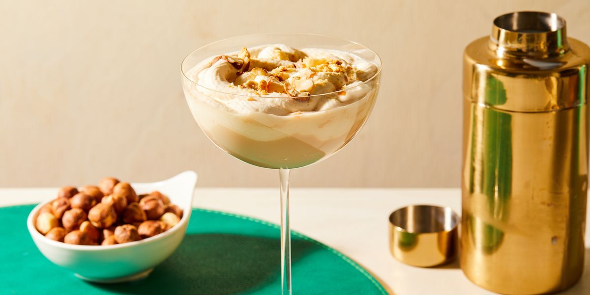 nutty irishman cocktail topped with crushed hazelnuts in a glass atop a green placemat