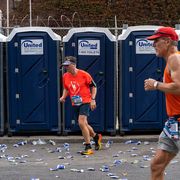 runners leave bathroom stalls during the new york city marathon in 2022