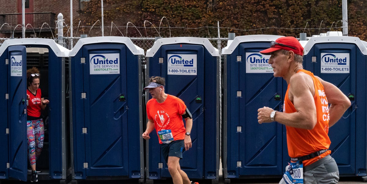 runners leave bathroom stalls during the new york city marathon in 2022