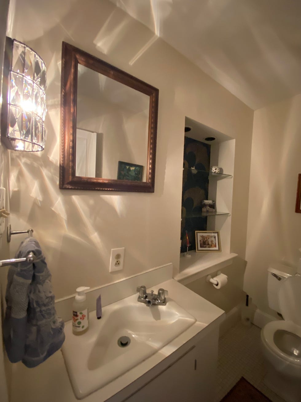 a bathroom with a mirror and sink