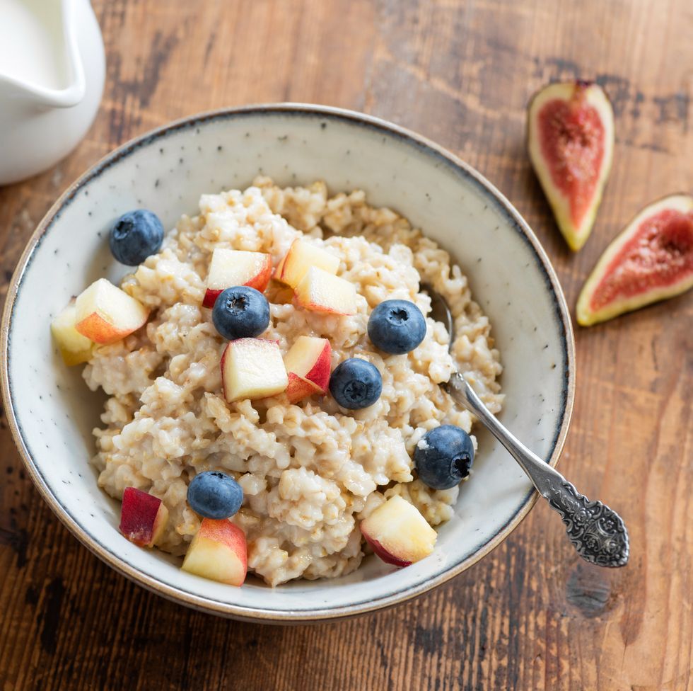 oatmeal porridge in a bowl with fruits and berries