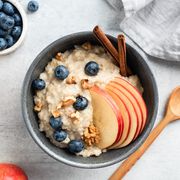 oatmeal porridge with apple, cinnamon and blueberries