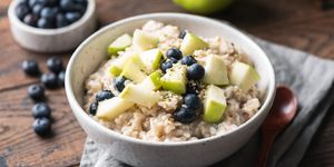oatmeal porridge with green apple and blueberries