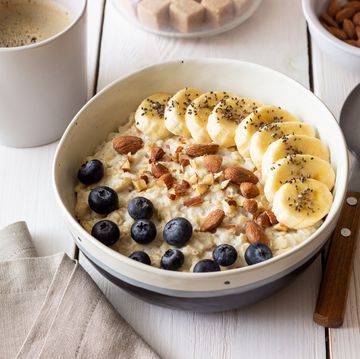 oatmeal with banana, blueberries, almonds and honey. healthy food. vegetarian food. breakfast.