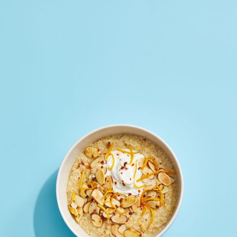 oatmeal with yogurt and toasted almonds on a blue background