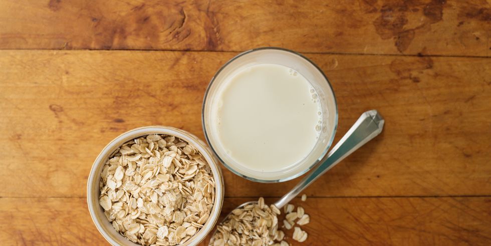 oats and oat milk against wood