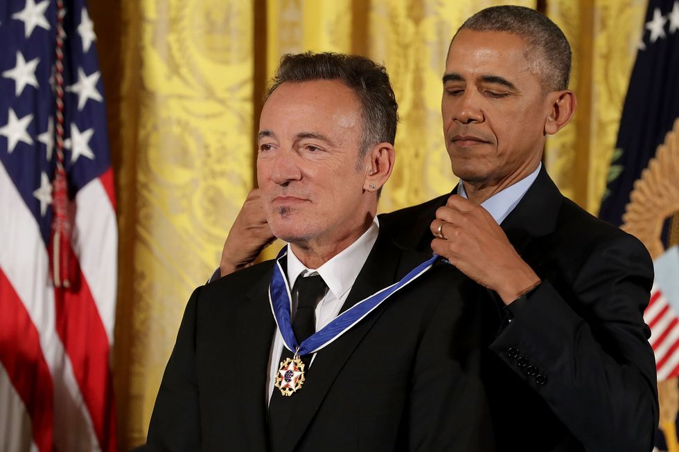 washington, dc   november 22  us president barack obama awards the presidential medal of freedom to popular music singer, songwriter and rock and roll legend bruce springsteen during a ceremony in the east room of the white house november 22, 2016 in washington, dc obama presented the medal to 19 living and two posthumous pioneers in science, sports, public service, human rights, politics and the arts  photo by chip somodevillagetty images