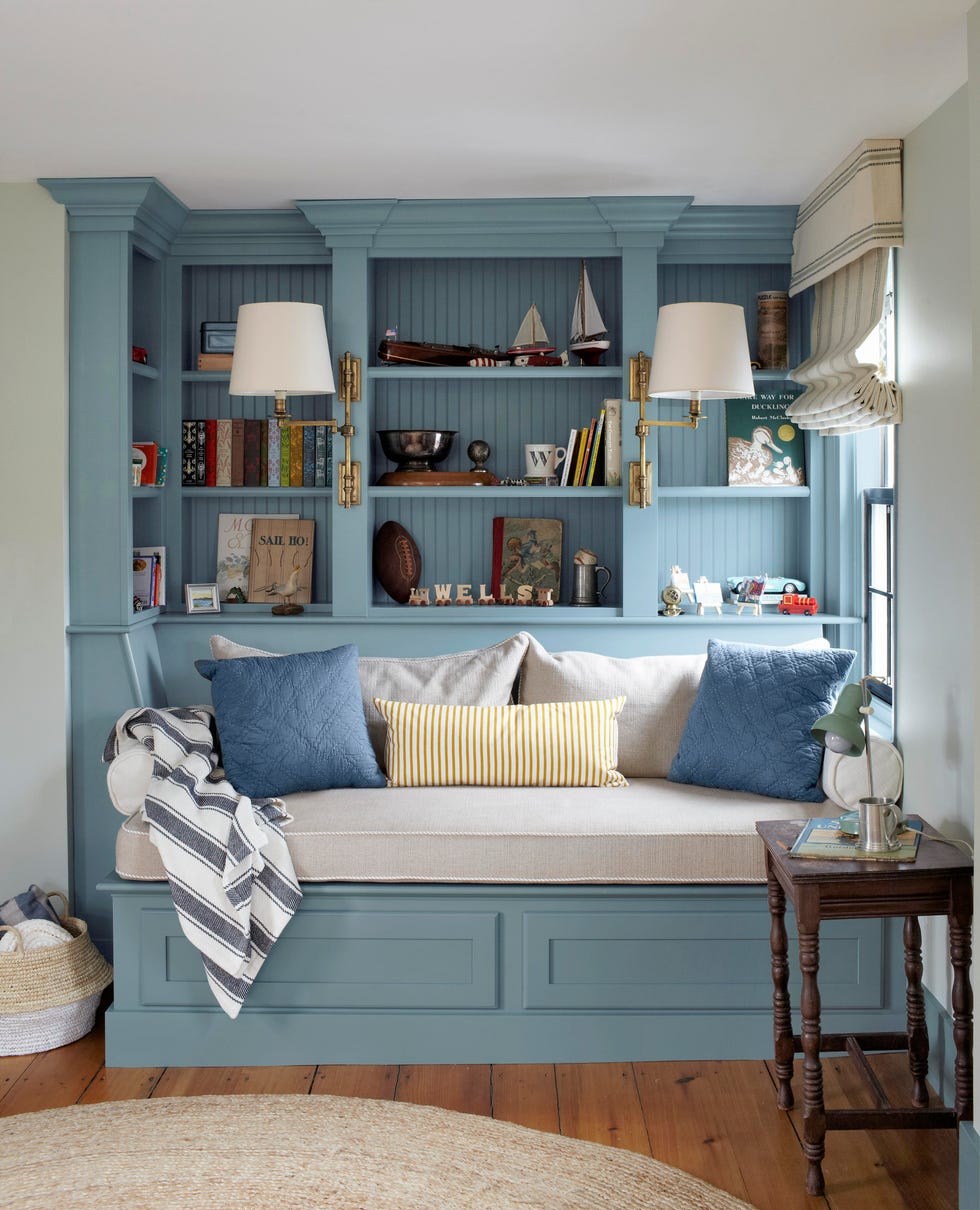 blue reading nook with daybed and bookshelves