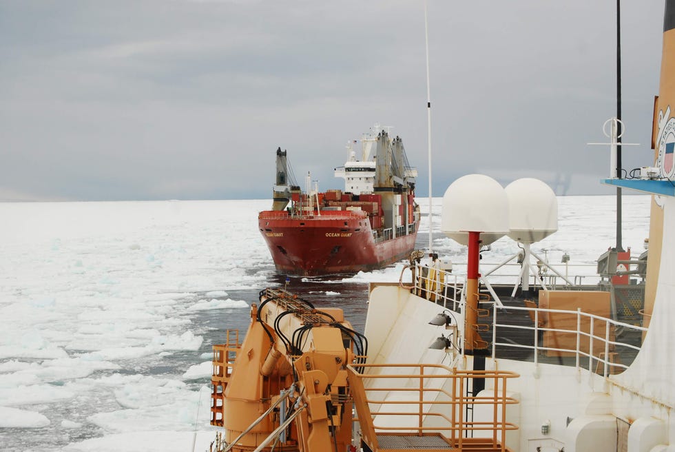 cargo ship navigating through icy waters