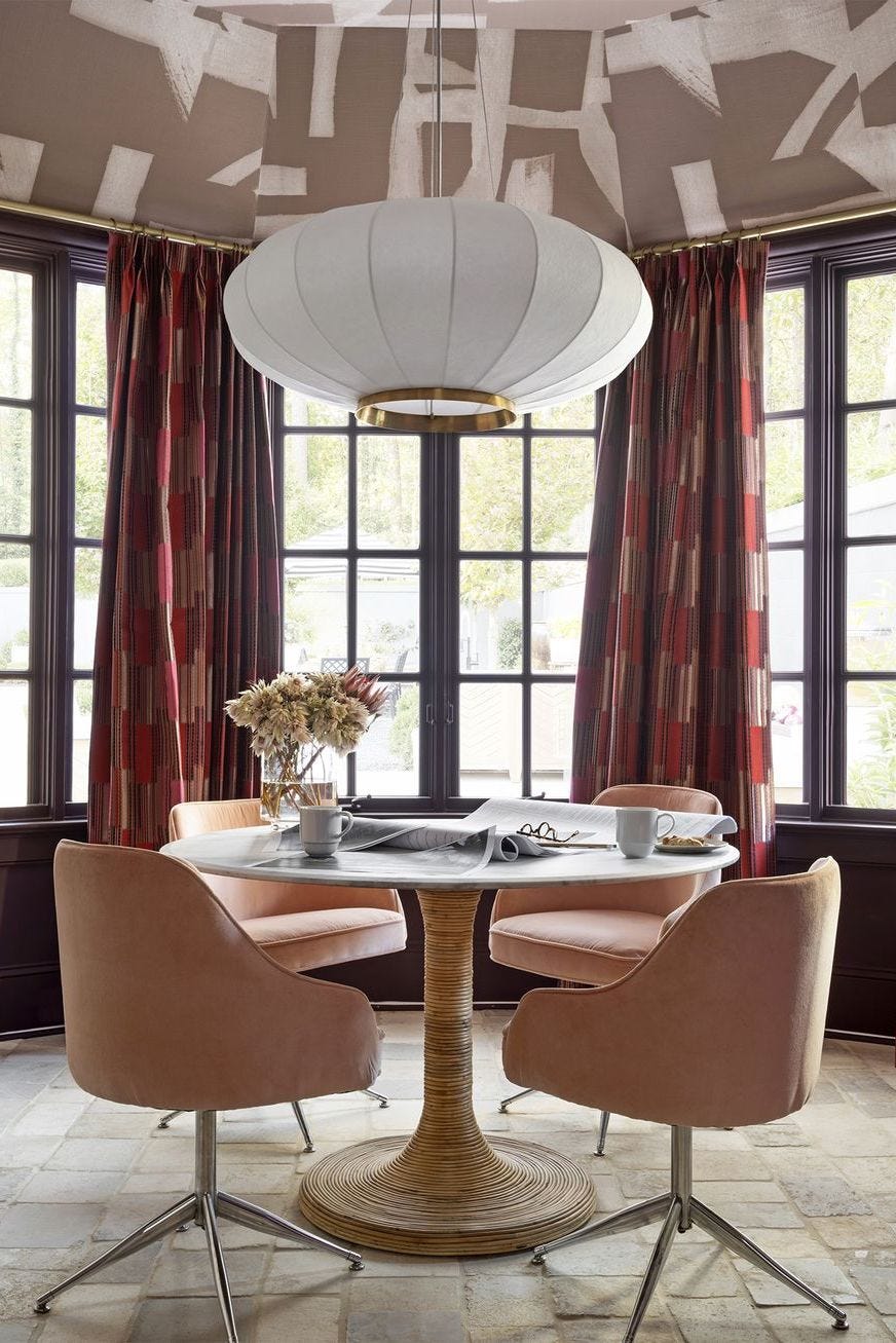 a round table with chairs around it